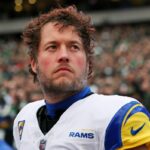 Matthew Stafford #9 of the Los Angeles Rams stands for the national anthem prior to the NFC Divisional playoff game against the Philadelphia Eagles at Lincoln Financial Field on January 19, 2025 in Philadelphia, Pennsylvania.