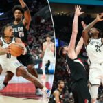 Nic Claxton, pivô do Brooklyn Nets, chuta sobre Donovan Clingan, pivô do Portland Trail Blazers.