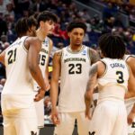 Michigan Wolverines players Yaxel Lendeborg #23, Morez Johnson Jr. #21, Aday Mara #15 and Elliot Cadeau #3.