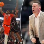 O atacante do Auburn Tigers, KeShawn Murphy (3), vai para a cesta enquanto o guarda do Mississippi State Bulldogs, Shawn Jones Jr. (5), defende durante o primeiro tempo.