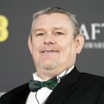 A casa do ativista de Tourette, John Davidson, foi assaltada enquanto ele estava em Londres participando da cerimônia do BAFTA (John fotografado no evento em 22 de fevereiro)