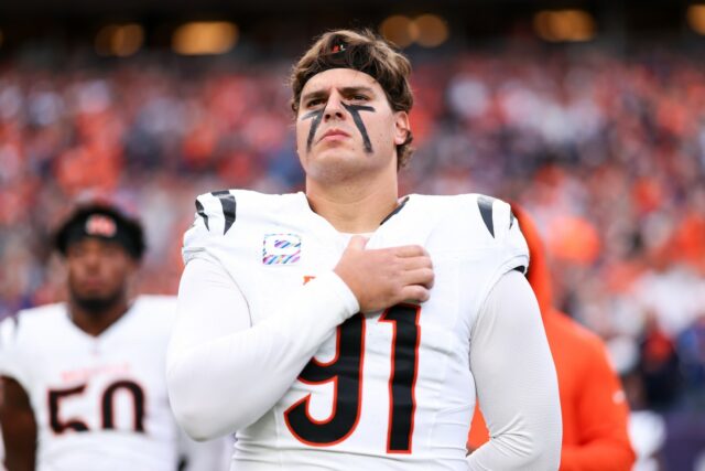 Trey Hendrickson #91 of the Cincinnati Bengals stands on the sideline during the national anthem prior to the game against the Denver Broncos at Empower Field at Mile High on September 29, 2025 in Denver, Colorado.