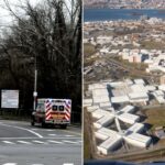 Uma ambulância se afasta da placa de entrada para Rikers Island, que exibe