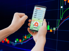 Os americanos veem os mercados de previsão esportiva como jogos de azar, conforme pesquisa revela preocupação crescente Os americanos veem os mercados de previsão esportiva à medida que a pesquisa sobre jogos de azar revela uma preocupação crescente. Aplicativo de apostas esportivas em smartphone com fundo gráfico crescente do mercado de ações, ilustrando mercados de previsão, jogos de azar on-line e conceitos de risco de negociação financeira