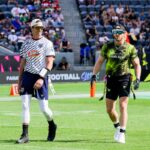 Tom Brady and Logan Paul on field together at Fanatics Flag Football Classic