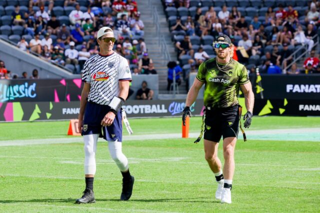 Tom Brady and Logan Paul on field together at Fanatics Flag Football Classic