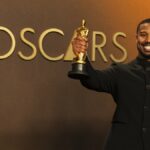 Compositores de Ejae e Golden recebendo o Oscar de Melhor Canção Original