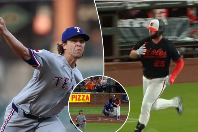 Pete Alonso acerta o primeiro home run de Orioles contra Pete Alonso, do Baltimore Orioles, centro, comemora com o técnico da primeira base Jason Bourgeois (36) depois de acertar uma única durante o primeiro turno de um jogo de beisebol contra o Texas Rangers, terça-feira, 31 de março de 2026, em Baltimore.