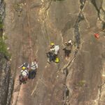 Um adolescente morreu e outro está lutando pela vida depois que a dupla caiu durante uma caminhada nas Glasshouse Mountains, na Sunshine Coast, em Queensland.