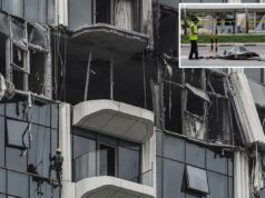 Sobreviventes do ataque de drone iraniano em Dubai foram presos após dizerem a seus entes queridos que estavam seguros – enviando-lhes fotos das consequências Um campanário avaliando os danos a um edifício após um ataque de drone em Dubai.