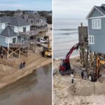 Tripulações usando duas escavadeiras para salvar uma casa em Outer Banks da Carolina do Norte do colapso no Oceano Atlântico.