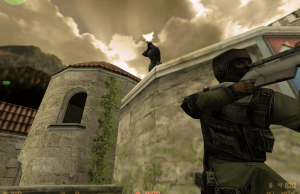 Valve resiste a ações judiciais alegando que caixas de saque violam leis de jogos de azar A Valve resiste a ações judiciais alegando que as loot boxes violam as leis de jogos de azar. Captura de tela do Counter-Strike mostrando dois personagens antiterroristas mascarados com rifles em um telhado e parede de pedra, com um céu nublado dramático ao fundo.