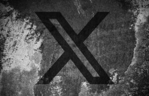 X diz que suspenderá os criadores do programa de divisão de receitas para postagens de IA não rotuladas de ‘conflito armado’ X (formerly Twitter) logo on a cracked wall