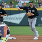 O jogador de campo do New York Yankees, Ryan McMahon, lança a bola depois de forçar a saída do terceiro base do Atlanta Braves, Austin Riley, para uma jogada dupla.