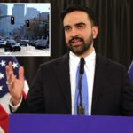 Prefeito Zohran Mamdani falando em entrevista coletiva com bandeiras americanas e de Nova York ao fundo.