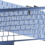 Apple obtém classificação inferior em reparabilidade de iPhones e MacBooks | Teclado MacBok Neo desmontado mostrado