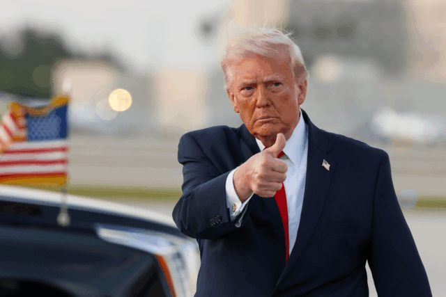 President Donald Trump waves to the media after walking off of Air Force One at Miami International Airport on April 11, 2026 in Miami, Florida.