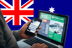 A repressão aos anúncios de jogos de azar na Austrália Anúncios de jogos de azar australianos em dispositivos móveis e laptops com interface de apostas esportivas e fundo da bandeira nacional destacando o debate sobre a reforma das apostas on-line