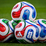 Official 2026 FIFA World Cup match balls, named Trionda, are seen on the field ahead of a friendly football match between Brazil and Croatia at Camping World Stadium in Orlando, Florida, on March 31, 2026.
