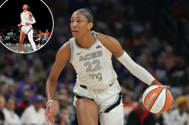 O pivô do Las Vegas Aces, A'ja Wilson (22), dribla contra o Phoenix Mercury durante a primeira metade do jogo 4 das finais de basquete da WNBA, sexta-feira, 10 de outubro de 2025, em Phoenix.