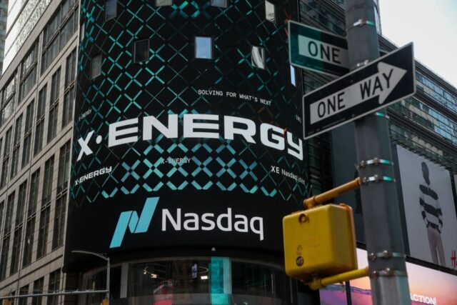 X-energy appears on a sign above the Nasdaq.