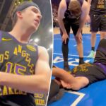 Luka Doncic deitado na quadra após cair durante uma jogada.