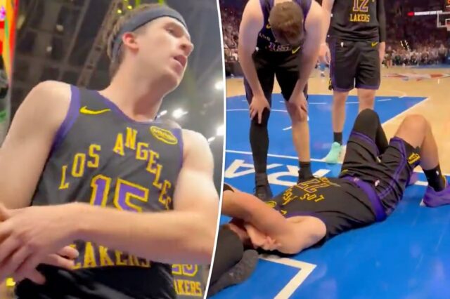 Luka Doncic deitado na quadra após cair durante uma jogada.