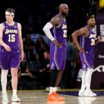 Lakers players Austin Reaves LeBron James and Marcus Smart against Houston Rockets for Game 5