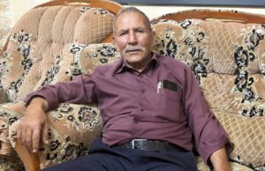 Ceticismo na Cisjordânia, já que os palestinos duvidam que as eleições locais mudem muito oliveiras com edifícios ao fundo