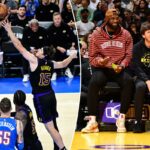 LeBron James e Austin Reaves sentam-se na quadra durante o jogo entre Oklahoma City Thunder e Los Angeles Lakers.