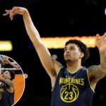 Yaxel Lendeborg nº 23 do Michigan Wolverines arremessa a bola durante o dia de treino do torneio de basquete masculino da NCAA de 2026 no Lucas Oil Stadium em 3 de abril de 2026 em Indianápolis, Indiana.