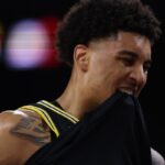 Michigan star Yaxel Lendeborg bites his jersey during Arizona game at NCAA Tournament