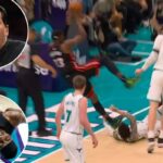 O central do Heat, Bam Adebayo, se contorce de dor depois de ser derrubado pelo LaMelo Ball do Hornets no segundo quarto, em 14 de abril de 2026.