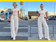 Este conjunto lounge campeão de vendas tem 40% de desconto e chega antes do Dia das Mães Uma mulher vestindo um top cinza claro de mangas curtas e calças largas combinando, segurando uma bebida e uma bolsa de ombro branca.