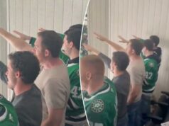 Fãs da NHL sendo investigados por saudação nazista durante o jogo dos Stars após o surgimento de um clipe chocante Vários homens, alguns vestindo camisetas verdes de hóquei do Dallas Stars, em pé e torcendo.