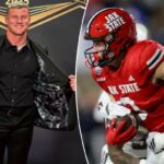 Brock Rechsteiner nº 3 do Jacksonville State Gamecocks é abordado por Jordan Stringer nº 7 dos Troy Trojans no primeiro tempo durante o IS4S Salute To Veterans Bowl em Cramton Bowl em 16 de dezembro de 2025 em Montgomery, Alabama.