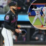 O arremessador substituto do New York Mets, Devin Williams (38), reage após correr.