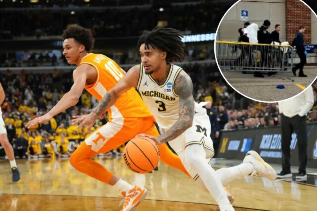 O guarda do Michigan Wolverines, Elliot Cadeau (3), reage no primeiro tempo contra o Tennessee Volunteers durante um jogo da Elite Eight do Midwest Regional do torneio masculino da NCAA de 2026.