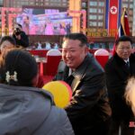 North Korean leader Kim Jong Un congratulating residents moving into their new homes at the inauguration ceremony of 10,000 flats at fourth stage in Hwasong area of Pyongyang.