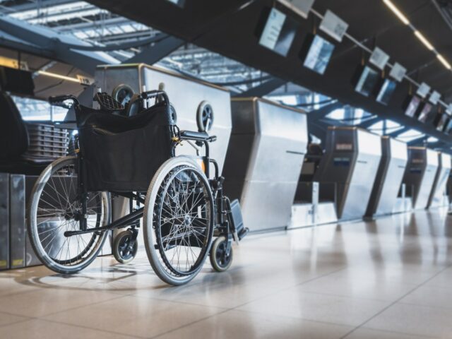 A wheelchair in an airport.
