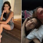 Elena Taber posando sentada em um deck de madeira.