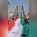 Iranianos formam correntes humanas através de pontes, em usinas de energia