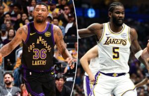 Marcus Smart, do Lakers, Deandre Ayton ansioso para voltar aos playoffs da NBA O jogador da NBA Luka Doncic, do Dallas Mavericks, segura uma bola de basquete enquanto é defendido por um jogador do Los Angeles Lakers.
