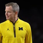 Head coach Dusty May of the Michigan Wolverines looks on during the first half of a game against the UConn Huskies in the National Championship of the 2026 NCAA Men's Basketball Tournament at Lucas Oil Stadium on April 06, 2026 in Indianapolis, Indiana.