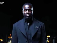 Novidades na Netflix: lista completa de programas e filmes em maio de 2026 A man in a black suit standing in front of a dark backdrop