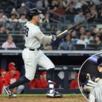 O defensor direito do New York Yankees, Aaron Judge #99, reage no banco de reservas depois de marcar em seu home run solo durante a 6ª entrada.