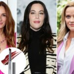 Um tubo aberto de batom vermelho, com a tampa ao lado, e uma listra de batom vermelho ao fundo.