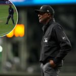 O árbitro CB Bucknor observa durante a oitava entrada de um jogo de beisebol entre o Milwaukee Brewers e o Tampa Bay Rays, terça-feira, 31 de março de 2026, em Milwaukee.