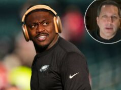 O que os Eagles provavelmente conseguirão por AJ Brown na negociação de grande sucesso dos Patriots Close de um homem usando fones de ouvido dourados, olhando para a esquerda, com uma expressão séria.