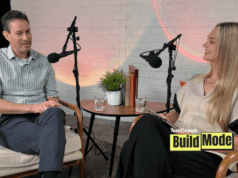 O que os fundadores podem aprender com as demissões e a recuperação de Anjuna A podcast-style interview setup shows a man and a woman seated across from each other in armchairs, speaking into microphones. They sit beside a small round table with water glasses, books, and a potted plant, against a white brick wall backdrop. A “TechCrunch Build Mode” logo appears in the lower corner.